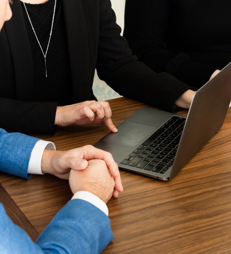 People sitting at a table talking about business